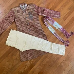 This is a Indian tradition wear for kids which is called a Sherwani.